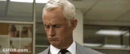 Man In Suit Looking Down GIF