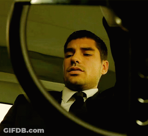 Man In Suit Looking In Mirror GIF