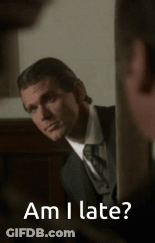 Man In Suit Looking In Mirror Saying Am I Late GIF