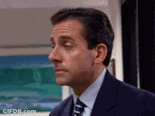 Man In Suit Looking Left GIF