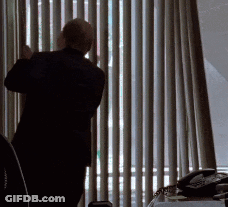 Man In Suit Looking Out Window GIF