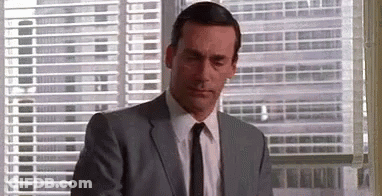 Man In Suit Looking Out Window GIF
