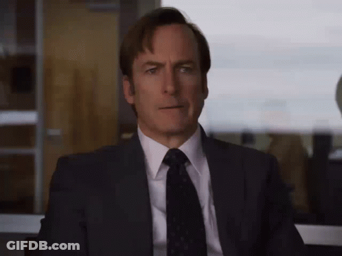 Man In Suit Looking Out Window GIF