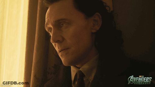 Man In Suit Looking Out Window With Avengers Roomday Poster GIF