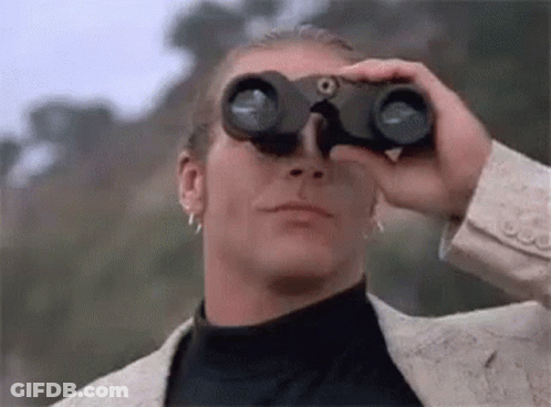 Man In Suit Looking Through Binoculars GIF