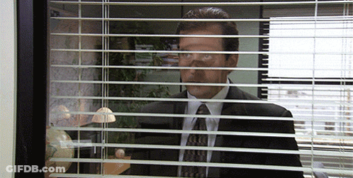 Man In Suit Looking Through Blinds GIF