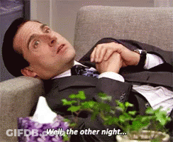 Man In Suit Lying On Couch Saying Well GIF
