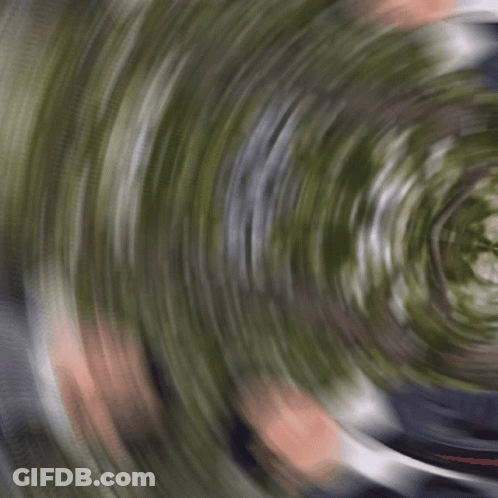 Man In Suit Lying On Ground GIF