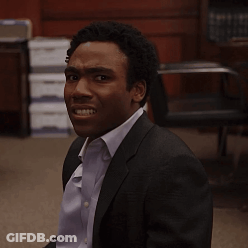 Man In Suit Making A Face GIF