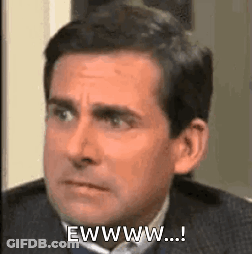 Man In Suit Making Eww Face GIF