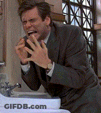 Man In Suit Making Face At Sink GIF