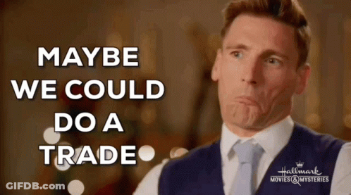 Man In Suit Making Face Saying Maybe We Could Do A Trade GIF