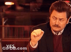 Man In Suit Making Fist And Saying Yes GIF