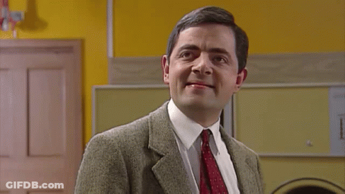 Man In Suit Making Funny Face GIF