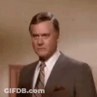 Man In Suit Making Funny Face GIF