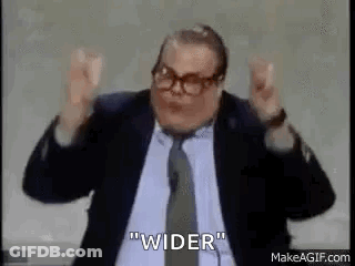 Man In Suit Making Funny Face At Microphone GIF