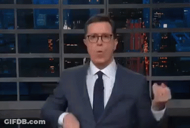 Man In Suit Making Funny Face At Window GIF