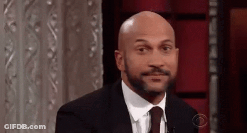 Man In Suit Making Funny Face GIF