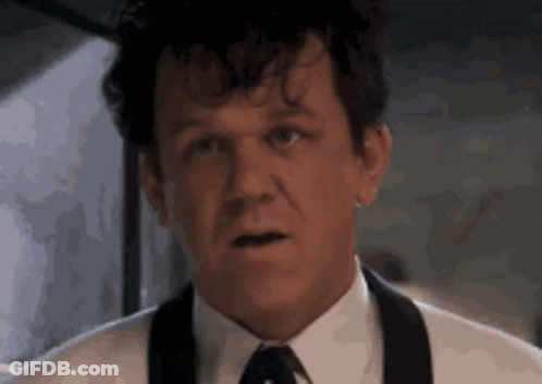 Man In Suit Making Funny Face GIF