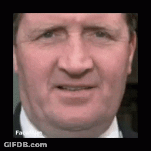 Man In Suit Making Funny Face GIF