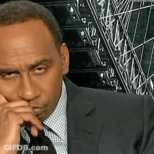 Man In Suit Making Funny Face GIF