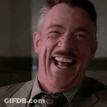 Man In Suit Making Funny Face GIF
