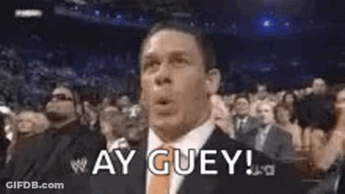 Man In Suit Making Funny Face In Crowd GIF