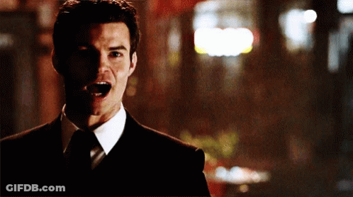 Man In Suit Making Funny Face GIF