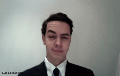 Man In Suit Making Funny Face GIF