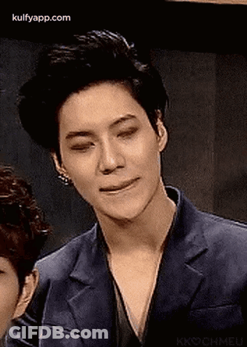 Man In Suit Making Funny Face Next To Another Man GIF