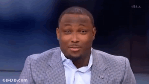 Man In Suit Making Funny Face On TV Show GIF
