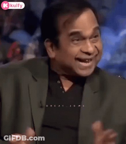 Man In Suit Making Funny Face On TV Show GIF