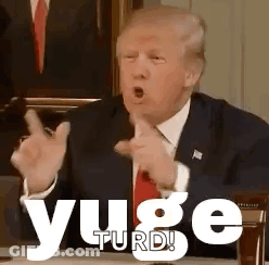 Man In Suit Making Funny Face Pointing At Camera GIF