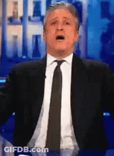 Man In Suit Making Funny Face GIF