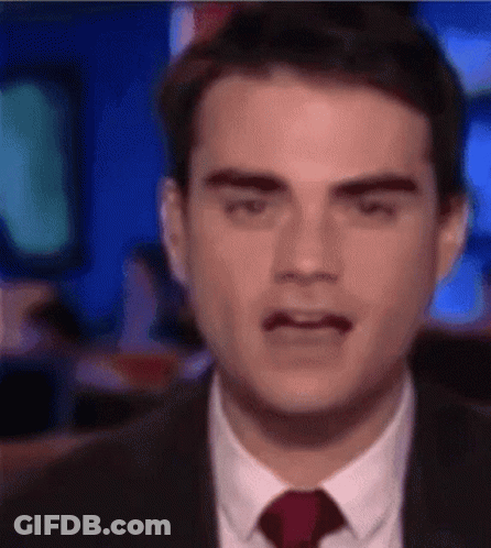 Man In Suit Making Funny Face GIF