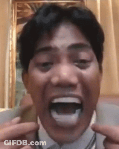 Man In Suit Making Funny Face GIF