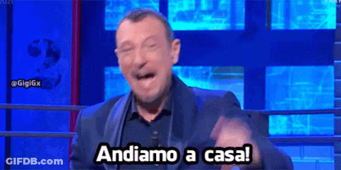 Man In Suit Making Funny Face Saying Andiamo A Casa GIF