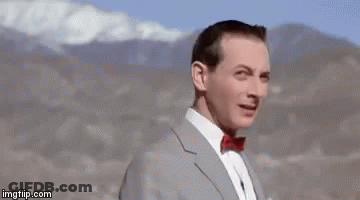 Man In Suit Making Funny Face Saying Andy GIF