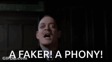 Man In Suit Making Funny Face Saying Faker GIF