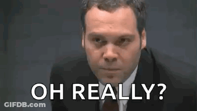 Man In Suit Making Funny Face Saying Oh Really GIF