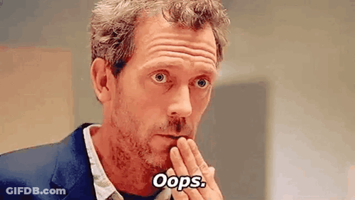 Man In Suit Making Funny Face Saying Oops GIF