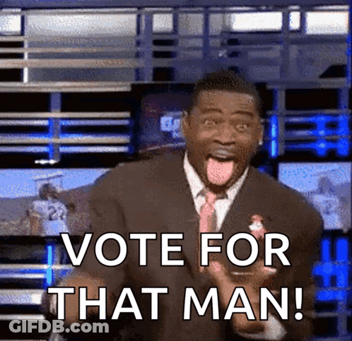 Man In Suit Making Funny Face Says Vote For That Man GIF