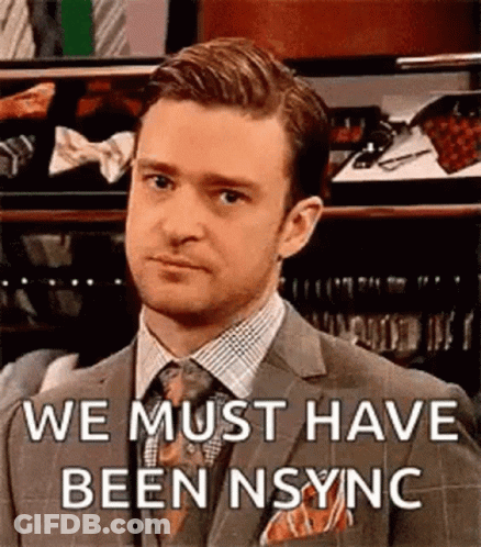 Man In Suit Making Funny Face Says We Must Have Been Sync GIF