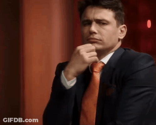 Man In Suit Making Funny Face GIF