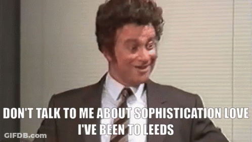 Man In Suit Making Funny Face Talking GIF