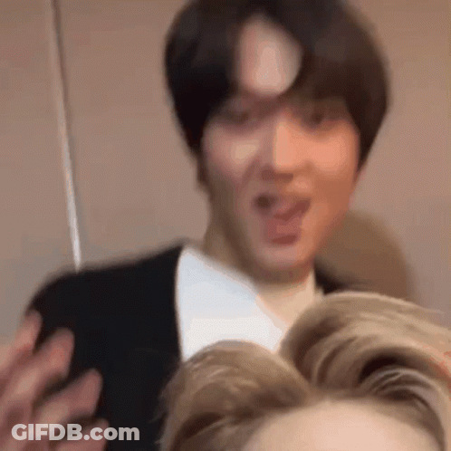 Man In Suit Making Funny Face Talking To Another Man GIF