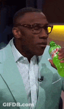 Man In Suit Making Funny Face To Woman GIF