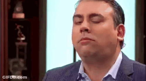 Man In Suit Making Funny Face GIF