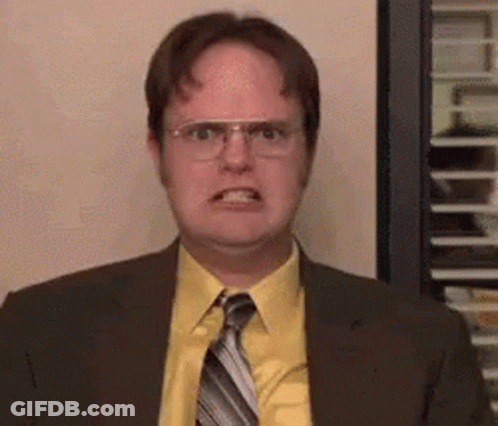 Man In Suit Making Funny Face With Glasses GIF