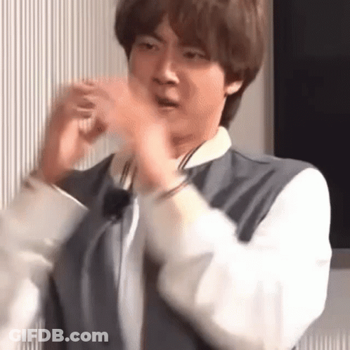 Man In Suit Making Funny Face With Hands GIF